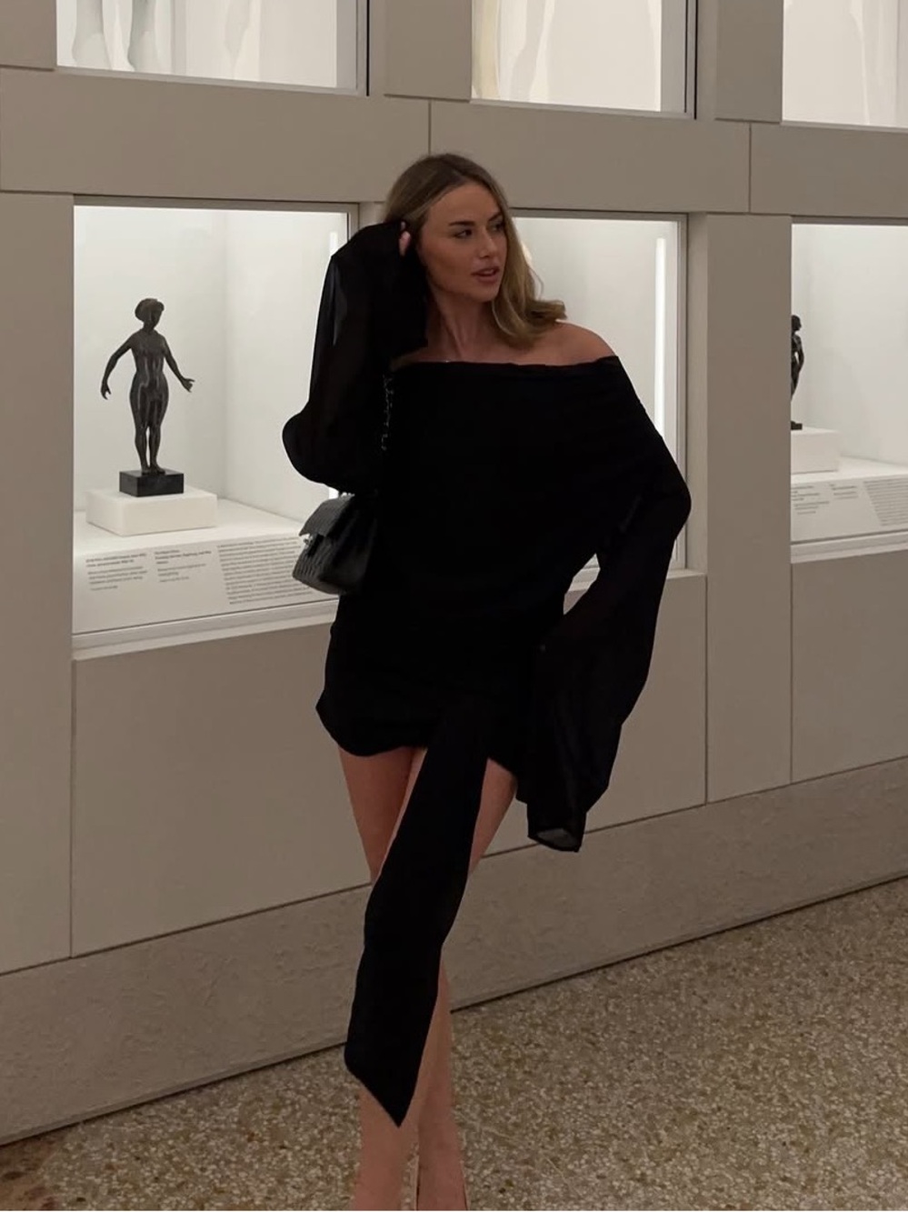 Off-Shoulder Black Mini Dress with Dramatic Sleeve Peppermayo